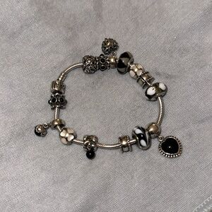 Pandora bracelet with charms included. Size 7.5